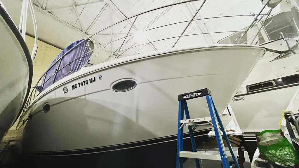 999 Carver Yachts 450 Voyager Pilothouse Motoryacht in storage with a blue ladder in front of it; used to illustrate the article about how much does a boat inspection cost